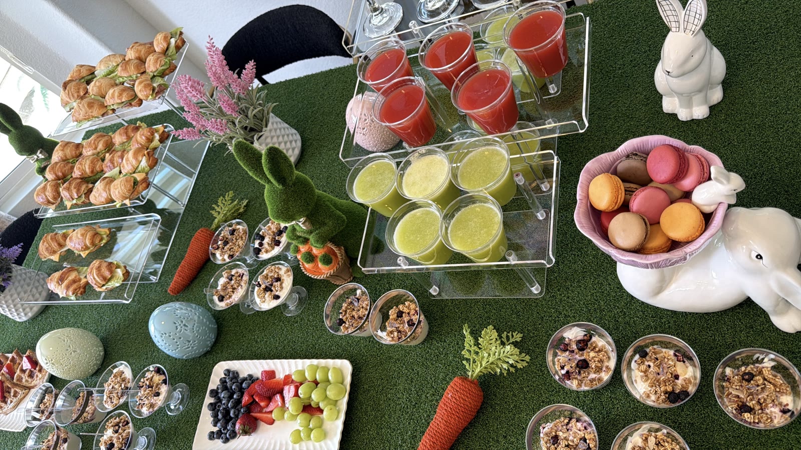 Easter brunch snack bar with croissants, fresh juices, macarons and granola cups